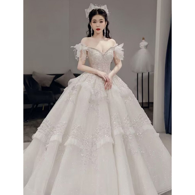 Off The Shoulder Luxury Wedding Dress With Pearls Lace Up Sexy Sleeveless Bride Ball Gown Vestido De Noiva Sweep Train